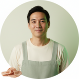 Circular portrait of a smiling East Asian man, Marcus Chen, wearing Aureon overalls against a cream and forest green backgrou