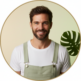 Circular portrait of Nate Smith, an outdoor influencer, smiling confidently in Aureon men's overalls against a soft cream bac